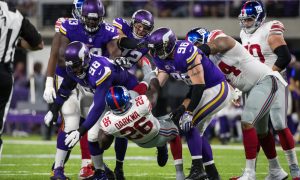 Oct 3, 2016; Minneapolis, MN, USA; New York Giants running back Orleans Darkwa (26) is tackled by Minnesota Vikings defensive tackle Linval Joseph (98) and defensive end Brian Robison (96) during the first quarter at U.S. Bank Stadium. Mandatory Credit: Brace Hemmelgarn-USA TODAY Sports